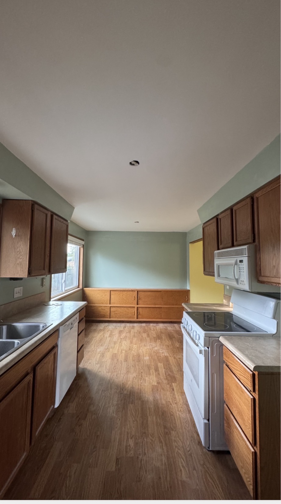Kitchen ceiling repair and drywall finishing before and after by Aesthetic Construction. After.